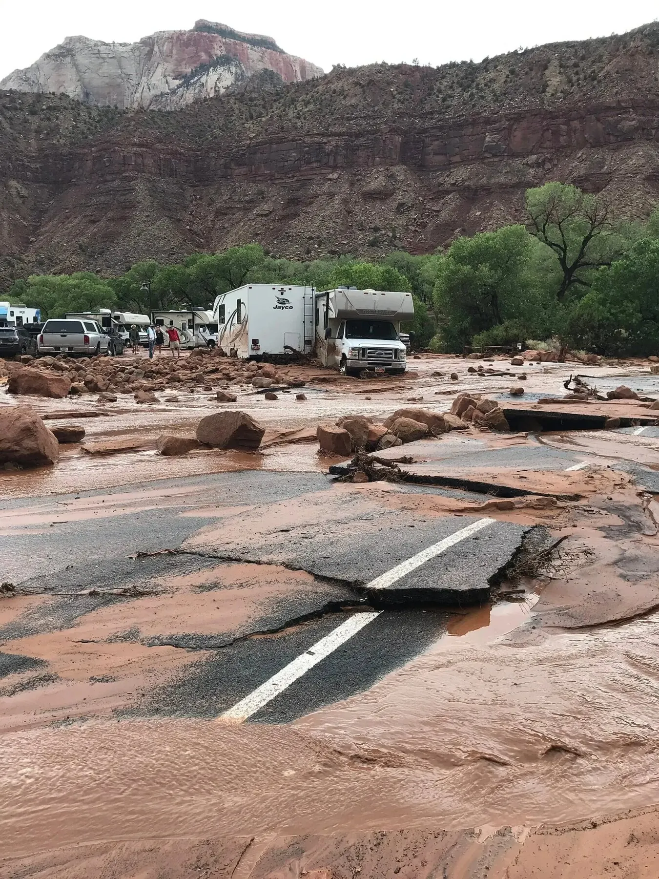 Damaged parking lot at Zion National Park South Entrance after a 2021 flash flood closed the road.