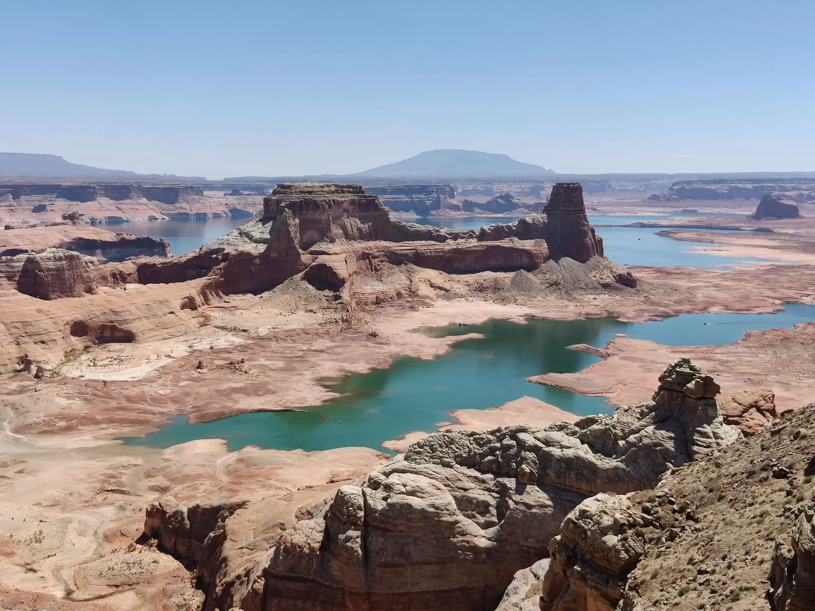 Turquoise water winding through red-rock cliffs