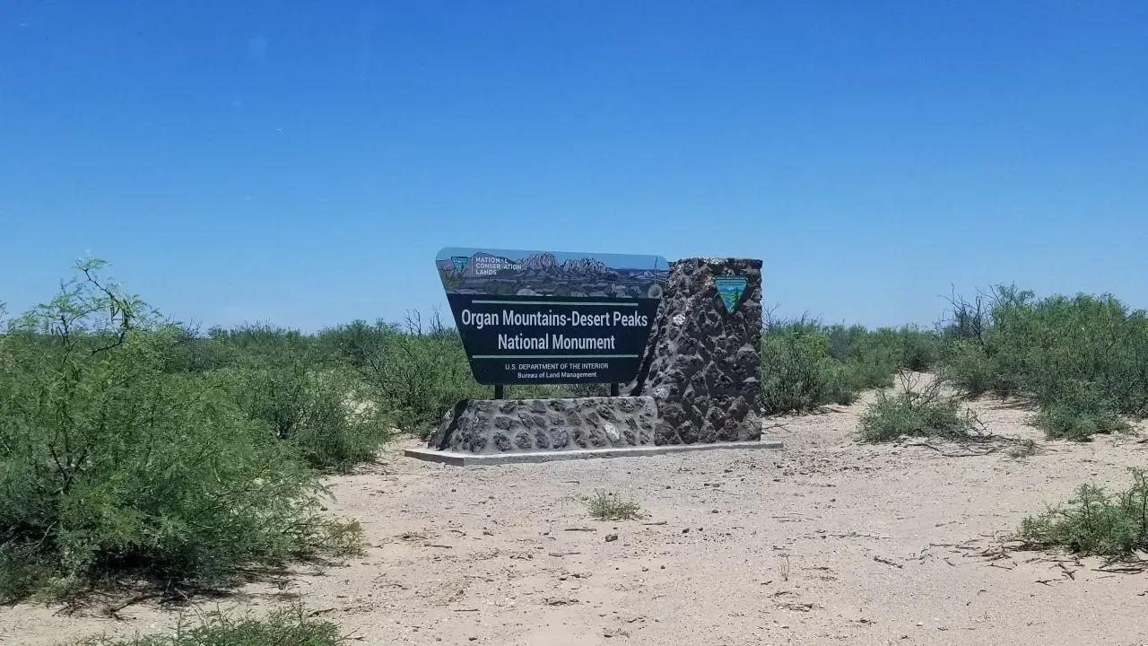 A BLM sign along a desert access road describing the land as part of a National Monument, on the road to Kilbourne Hole, New Mexico