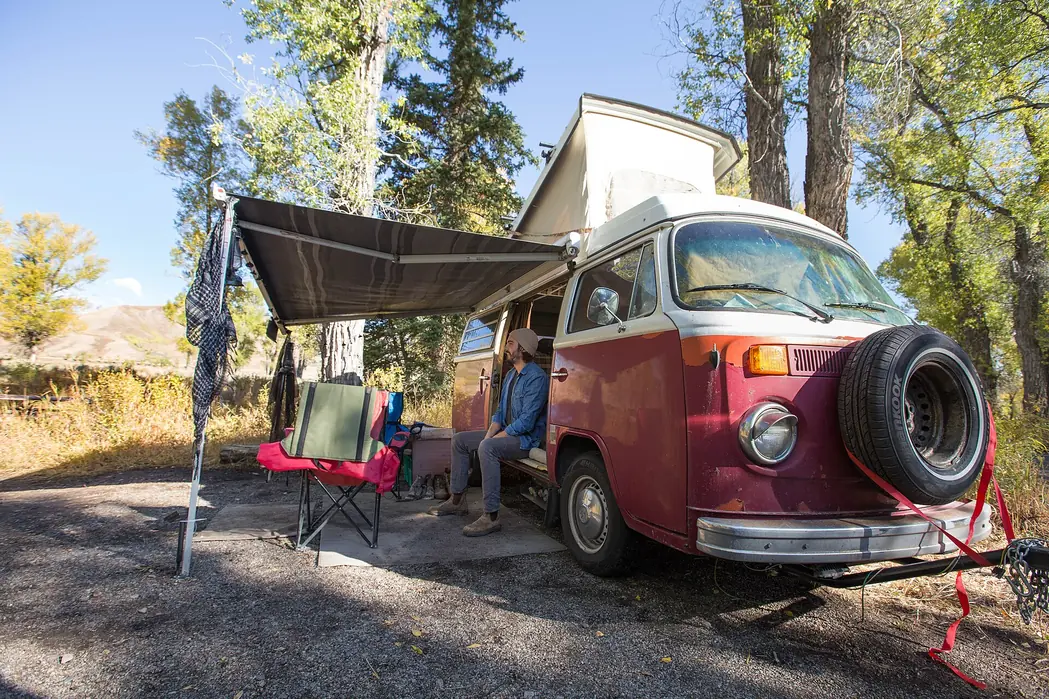 Vintage Volkswagen camper van at a campsite in Gros Ventre Campground, Grand Teton National Park.