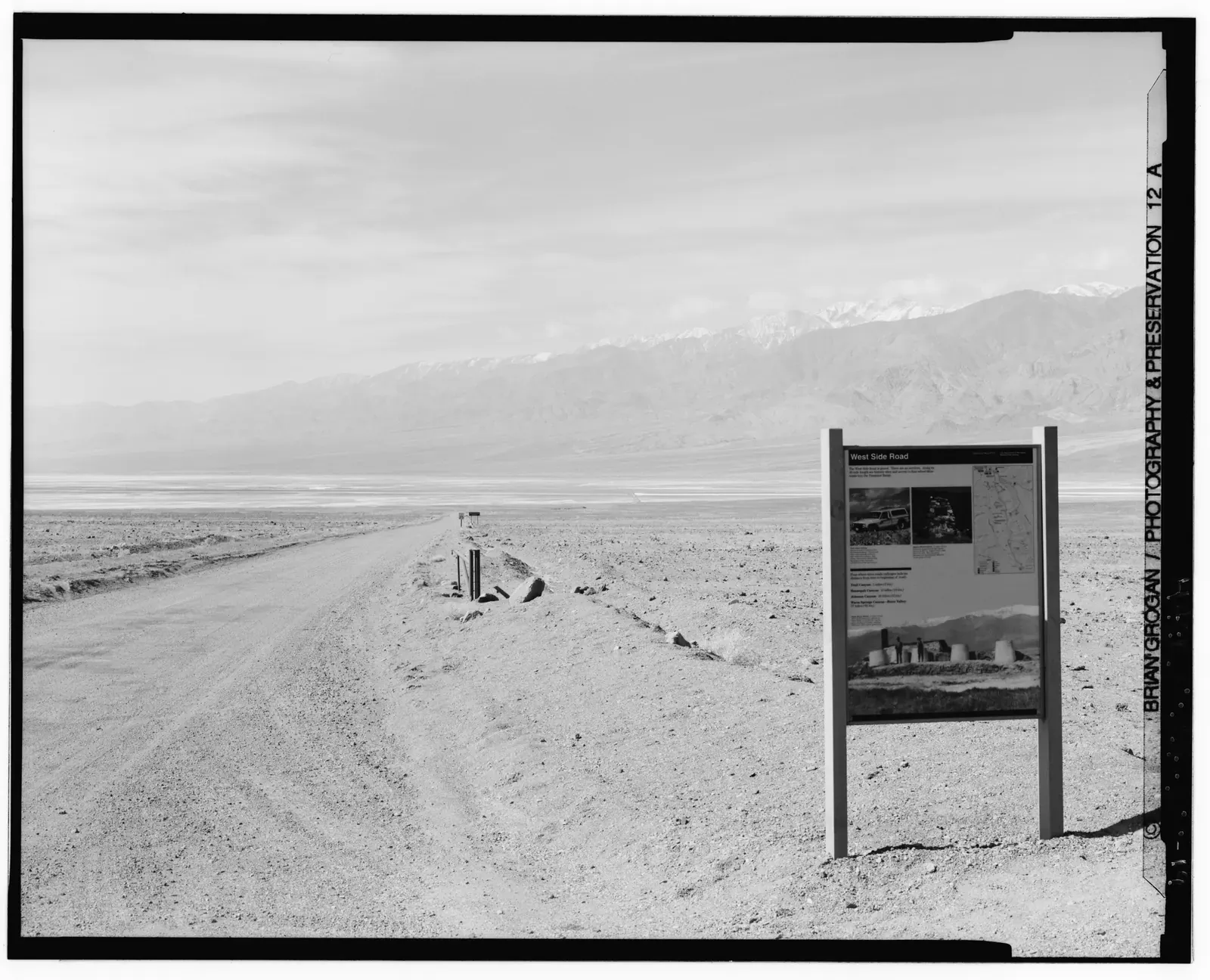 Historic southwest-facing view of West Side Road at its Highway 178 junction and interpretive pullout