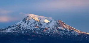The north face of Mount Shasta, a 14,179-foot Cascade stratovolcano, at sunset in late January.